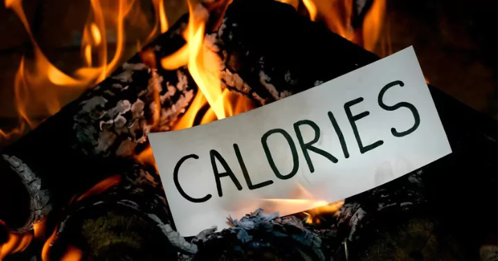 piece of paper written on it "calories" burning on fire
