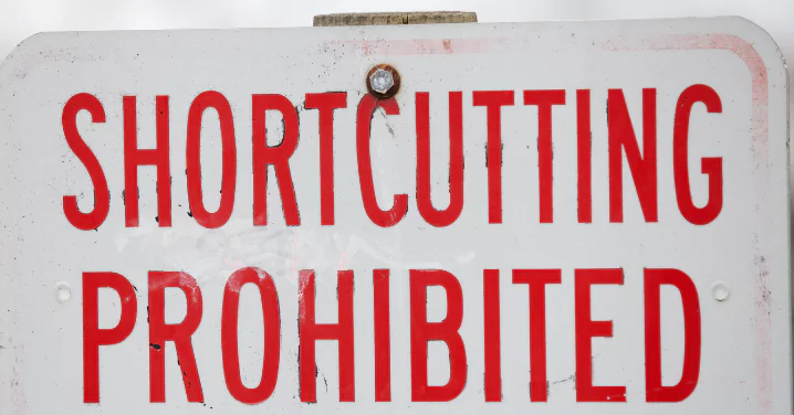 shortcutting prohibited written in red on a sign